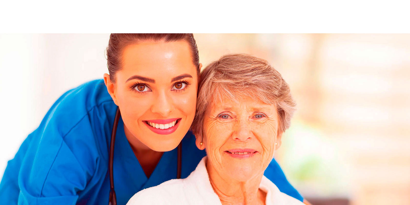 A woman and an older lady smiling for the camera.