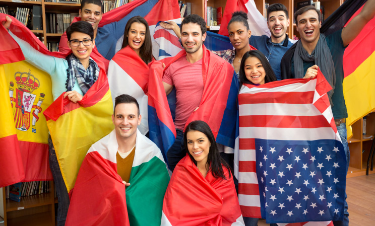 A group of people holding flags in their hands.